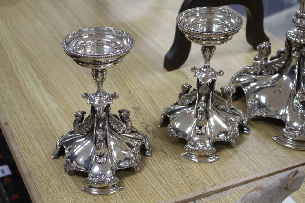 A Victorian electroplated three-piece table garniture by Elkington & Co. (lacking glass bowls),